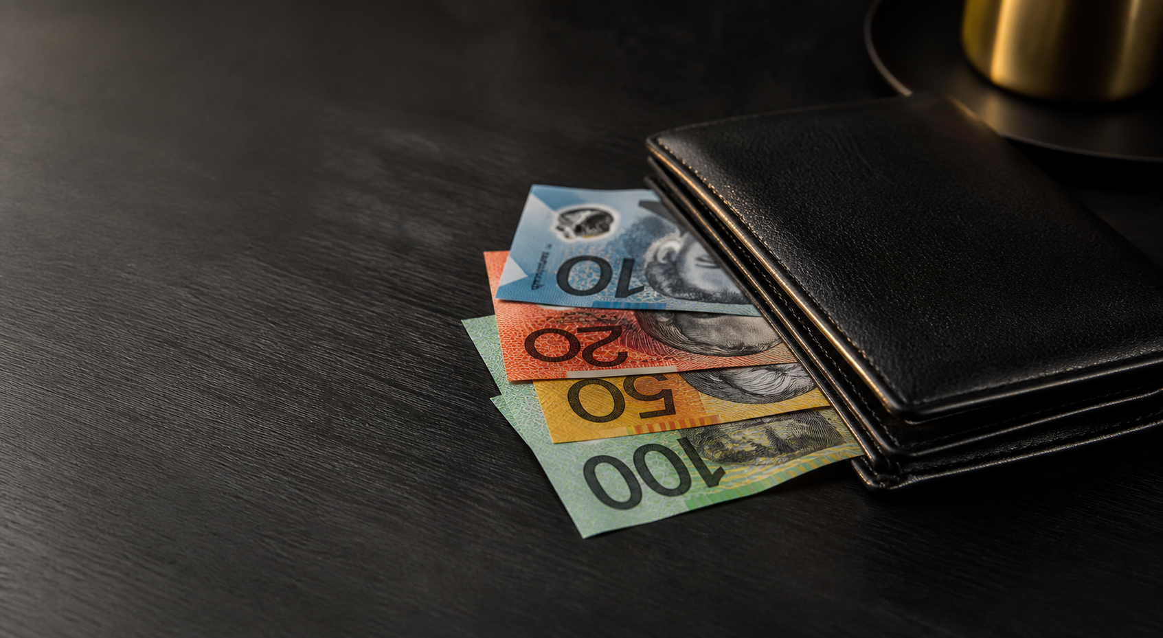 Australian cash notes and wallet on a dark premium surface